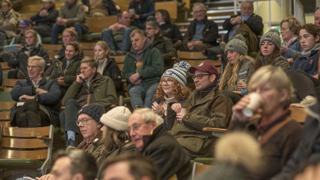 An audience assembled in the sales ring.